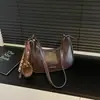 Otoño 2026 Nuevo Elegante Chic Bolso de Hombro de Moda Estilo Bollo Bolso Cruzado de Hombro Único de Alto Valor Bolso Cruzado de Nicho