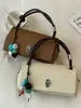 Bolso de textura de alta calidad para mujer 2026 nuevo estilo moderno versátil bolso cruzado bolso pequeño cuadrado de mano exquisito bolso de mano pequeño para salir