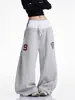 Fabricante Original Retrô Americano Calça de Moletom Patchwork com Letras de Cintura Dupla Unissex Perna Larga Solta Costa Oeste