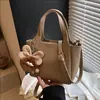 Bolsas al por mayor transfronterizas para mujer Verano 2025 Nuevo Bolso de hombro casual Bolso de mano para mujer Bolso tipo cubo cruzado simple