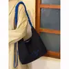 Bolsa de Lona Grande Capacidade Estilo Coreano Feminina 2026 Nova Casual Versátil Bordado de Letra Ombro Único Transversal