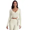 Conjunto de pantalones de yoga europeos y americanos transfronterizos con manga larga de color liso, amigable con la piel, transpirable, hermoso diseño en la espalda, ajuste ceñido, pantalones de fitness adelgazantes