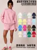 Conjunto de ropa europea y americana para mujer transfronterizo: sudadera casual y shorts, sudadera holgada de forro polar color liso, cuello medio alto, estilo 'dopamine hot girl'