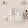 Blusa de Encaje Cómoda de Manga Larga para Niña Estilo Nuevo Primavera y Otoño 2026 Camiseta Interior para Bebé con Dobladillo de Encaje y Lazo
