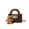 Bolso de mano de alta gama para comercio exterior, nuevo bolso cubo retro de nicho estilo coreano, elegante bolso de hombro, moderno bolso cruzado
