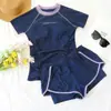 Traje de baño de dos piezas para mujer de nuevo estilo transfronterizo con top y parte inferior separados, con diseño de manga corta y ajuste cómodo