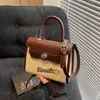Bolso de Mano Casual Nicho Estilo Coreano para Mujer 2025 Nuevo Sentido de Alta Gama Bolso de Hombro Kelly Versátil Bandolera Bolso Cuadrado Pequeño