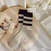 Colección exclusiva de otoño transfronteriza: Calcetines de mujer Melard de doble raya, modernos y lindos, de longitud media hasta la pantorrilla, versátiles y con un estilo preppy