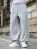Pantalones deportivos de AliExpress para hombre con tachuelas laterales y dobladillo dividido, pantalones largos casuales de pierna ancha con cordón estilo retro americano, holgados