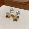 Modernos y Minimalistas Brazaletes para Oreja Retorcidos de Piedra Ojo de Tigre para Mujer, Pendientes Versátiles Vintage, Accesorios para Orejas de Otoño e Invierno con un Toque de Lujo Ligero y de Alta Gama