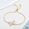 Conjunto de Brincos, Colar, Anel e Pulseira de Vidro Colorido com Diamantes em Formato de Borboleta - Moda Europeia e Americana - Vendido em Larga Escala - Para Mulheres