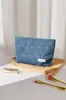 Estilo Nuevo Ins Simple Mezclilla Corazón Lazo Tela Bolsa de Maquillaje Viaje Cuidado de la Piel Neceser Bolsa de Almacenamiento Almohada