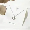Collar de amor sencillo de estilo japonés y coreano, cadena de clavícula con astas cruzadas, flor, perla y colgante de latido de corazón de celebridad cibernética.