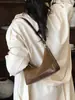 Transfronterizo 2026 nuevo modelo alta calidad diseño nicho esmerilado alto valor bolsa para axila bolso de hombro retro bolso cruzado para mujer