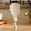 La cuchara de arroz de cocina tipo ventosa puede ser una olla arrocera vertical antiadherente de grado alimenticio resistente a altas temperaturas para uso doméstico.