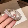 Pulsera de perlas con lazo de doble capa estilo vintage francés, diseño único y versátil, joyería de lujo ligero y de alta gama