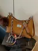 Elegante bolso de dos tonos para mujer, nuevo modelo de moda 2026, bolso de hombro simple, versátil para el trabajo y uso casual, bolso cruzado