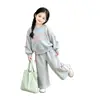Conjunto de Moda Ins para Niñas con Lazo 2026 Primavera y Otoño Sudadera de Moda y Pantalones de Pierna Ancha Estilo Coreano Conjunto de Dos Piezas