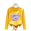 Camiseta básica para meninas para primavera e outono 2026 novo modelo, top infantil de algodão puro fofo estiloso, camiseta infantil de manga longa
