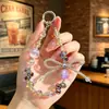 Nuevo accesorio de cadena para teléfono con lazo de cuentas de cristal de celebridad de internet, sección corta, colgante para teléfono, colgante anti-pérdida para teléfono, colgante para bolso