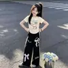 Moda Coreana 2026 Elegante y Único Top de Manga Corta Verano Dulce Caricatura Lazo Casual Pantalones de Pierna Ancha Conjunto de Dos Piezas