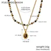 Collar con colgante ovalado de ojo de tigre con cuentas de piedra natural para mujer, estilo nicho, ligero, de lujo, vintage, de doble capa, con cadena de clavícula de acero y titanio superpuesta.