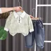 Estilo Coreano Primavera y Otoño Ropa Deportiva Manga Larga Tie-Dye Patrón Vertical Top de Corbata Pantalones de Mezclilla Conjunto de Dos Piezas para Niños Primavera Venta al por Mayor