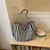 Bolsa tote listrada transfronteiriça, bolsa de ombro de grande capacidade para mulheres, bolsa simples e versátil para o dia a dia, nova coleção de outono, bolsa casual estilo coreano