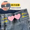Botón con forma de corazón para ceñir la cintura, una herramienta mágica para ajustar el tamaño de la cintura de faldas y pantalones, un botón decorativo para apretar y fijar