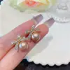 Brincos de Pérola com Laço Estilo Novo Coreano para Mulheres, Brincos Stud de Strass Brilhantes Tendência Luxo Leve Nicho