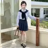 Conjunto de Menina Primavera e Outono 2026 Novo Doce Menina Estilo Coreano Crianças Médias e Grandes Estilo Escolar Xale Camisa Saia Plissada