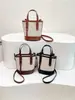 Bolsa pequena de mão color-blocking de alta qualidade para mulheres, nova 2025, versátil, estilosa, bolsa tipo balde transversal, bolsa de ombro única fashion