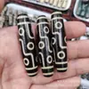 Atacado de fábrica Xizang ágata três olhos nove olhos Pingente de contas preto e branco alto teor de óleo dentes amarelo contas