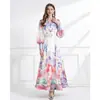 Vestido elegante estilo resort NATALIYA 2026 con cuello de blazer, estampado floral, mangas abullonadas, ceñido a la cintura y bajo con volantes