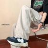 Pantalones de trabajo de estilo japonés de primavera y otoño con bolsillos grandes, pantalones casuales de moda para la calle, pantalones retro de color sólido, piernas anchas y sueltas para hombres y mujeres.