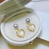 Pendientes de Zirconia con Diseño de Amor Atmosférico Simple de Venta Caliente Europea y Americana Pendientes de Perla de Agua Dulce de Moda Vintage de Nicho para Mujeres