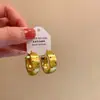 Pendientes Metálicos Geométricos de Ola y Puntos 2026 Nuevo Estilo Popular Pendientes de Alta Gama para Mujeres Estilo Elegante de Socialité