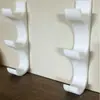 Soporte de pared multi-rollo transfronterizo 2026/3D, organizador de tres niveles de pared para film transparente y papel pergamino para la cocina
