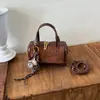 Bolso Retro de Gama Alta para Mujer 2026 Nuevo Bolso Cubo Lujo Ligero Colgante Bolso de Hombro Único Versátil para Viajar Bolso Cruzado Comercio Exterior
