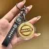 Shuibeijin Ouro Ouro Puro 999 Logotipo de Carro Chaveiro Pingente Folha de Ouro Presente Transmissão ao Vivo Bmw Mercedes-Benz Audi Bba