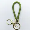 Venta al por mayor del fabricante Llavero de Cuerda de Aleación Tejida y Cuero Accesorios Colgantes Material PU Bolsas Pequeñas de Regalo Accesorios para Llaveros