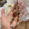 Cadena para teléfono móvil de caramelo duro ámbar casero original Ins cámara ccd cuentas diy cordón frío colgante retro
