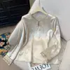 Nueva ropa retro de estilo chino de cuello redondo de alta gama para mujer, nuevo modelo de primavera, top de base de manga larga de jacquard bordado intrincadamente