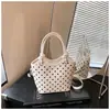 Bolso de Lunares de Nicho Súper Caliente para Mujer Nuevo Estilo Otoño/Invierno 2026 Bolso Cruzado Versátil Retro Bolso de Cubo Exquisito para Llevar en la Mano