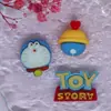 Cor sólida Doraemon gatinho jingle acessórios de cola de creme atacado acessórios de resina atacado adesivo para capa de celular