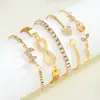 Pulsera de tulipán de diseño europeo y americano de alta gama transfronteriza con mariposa de 8 caracteres, accesorios de 5 piezas, venta al por mayor de fábrica de Yiwu