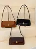 Bolso de hombro versátil nuevo transfronterizo, un bolso de estilo baguette de alta gama, retro y sutilmente lujoso, perfecto para el uso diario a la moda y el uso casual, diseñado para llevarse debajo del brazo