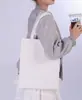 Bolsas de lona em estoque para a temporada de volta às aulas, personalizáveis com logotipo e estampa, sacolas de presente de alta qualidade e reforçadas