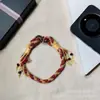 Lanyard de teléfono colorido tejido a mano, correa de muñeca de estilo étnico, cordón anti-pérdida con borla y cuenta, adorno colgante para funda de teléfono, venta al por mayor