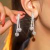 Europa y Estados Unidos temperamento transfronterizo brillante diamantes completos magníficos aretes largos mujeres moda aretes de alto sentido joyería para la oreja al por mayor
